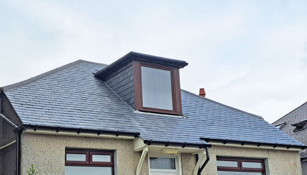 Detached house with dormer window, new roof fitted