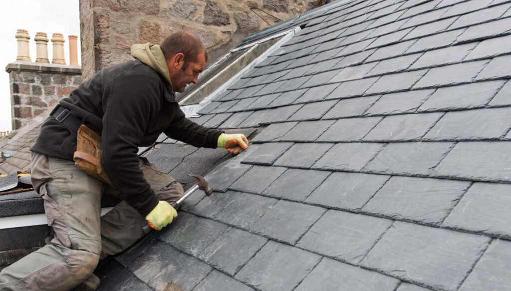 High quality tradesman fitting slate roof in Aberdeen