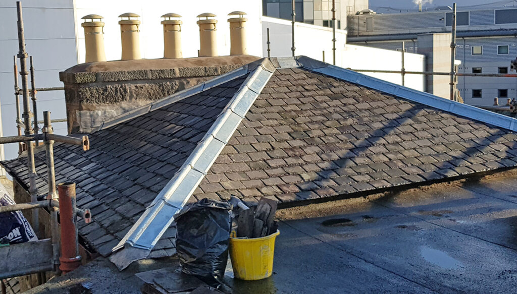 New chimneys and slates on high roof in Aberdeen