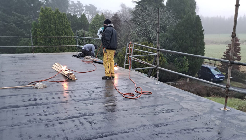Work in progress on large roof of boarding kennels